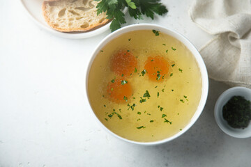 Traditional homemade chicken broth with vegetables