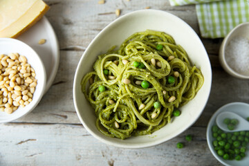 Spaghetti with pesto sauce and green pea