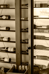 Fototapeta na wymiar Defocused view of wine storage room with open glass door