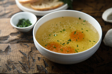 Traditional homemade chicken stock with vegetables