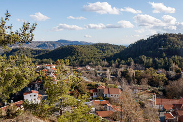 Panoramic view of small village in hill valley among mountain forest, Troodos, Cyprus