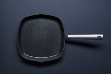 empty grill on black kitchen table