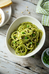 Spaghetti with pesto sauce and green pea