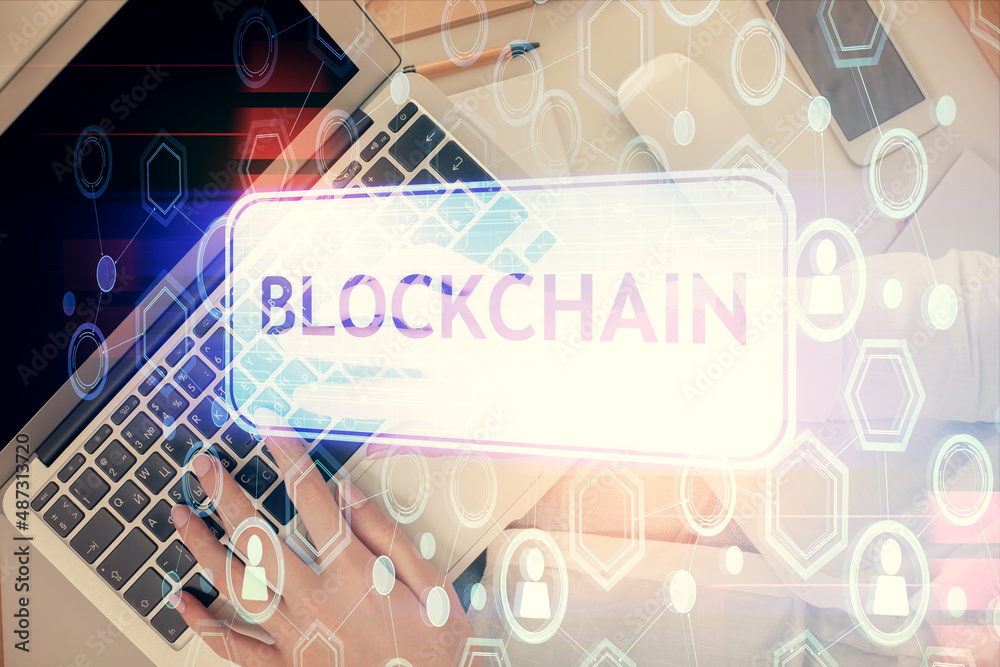 Poster double exposure of woman hands working on computer and blockchain theme hologram drawing. top view. 