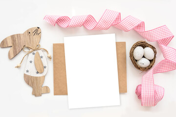 Greeting card easter mockup with wood bunny and easter eggs on white background