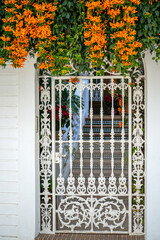 Obraz premium Beautiful streets of Nerja city - Malaga - Spain. Typically Andalusian village with white houses and small streets. Touristic travel destination ln Costa del Sol. Flower pot on the wall. Winter time