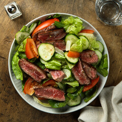 Fresh vegetable salad with beef steak