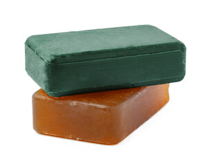 Beige and green soap bars on white background