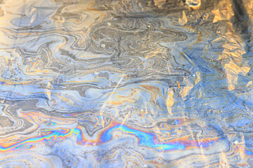 spilled gasoline rainbow background, industrial hazard spill pollution, abstract texture multicolored