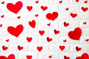 small red paper hearts on white background, love background concept