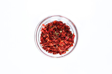 Series, spices on a white background, isolate, in different angles. Red, orange, bright pepper mix in a bowl