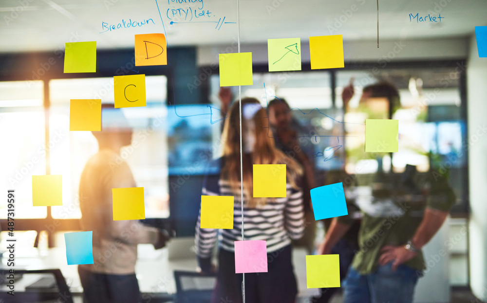 Poster creative thinkers in their natural habitat. shot of colleagues having a brainstorming session with s