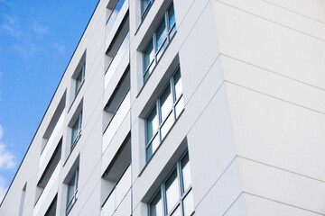 Luxurious apartments for sale. Bialystok city in Poland architecture background. High block of flats living area. New build neighborhood modern style. Real estate market in Europe.