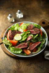 Fresh vegetable salad with beef steak