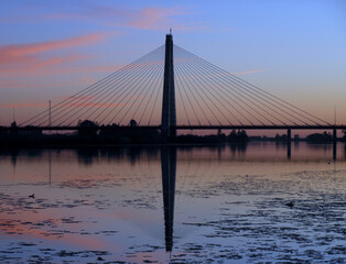 Sunset on the bridge over the river