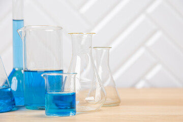 Laboratory glassware with test tubes. flasks, dropper, petri dishes, measuring cups and cylinders for scientific laboratories, laboratory equipment and analysis