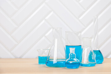 Laboratory glassware with test tubes. flasks, dropper, petri dishes, measuring cups and cylinders for scientific laboratories, laboratory equipment and analysis
