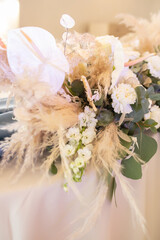 banquet table is decorated with plates, cutlery, glasses, candles and flower arrangements
