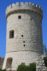 Fototapeta na wymiar ancient tower in the old town of Cres, island Cres, Croatia