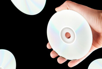 image of cd disk hand dark background 