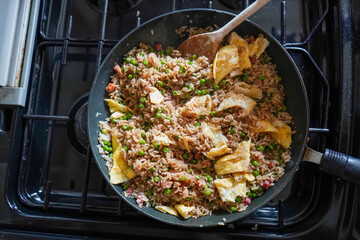 Close up of fried rice cooking in a frying pan 