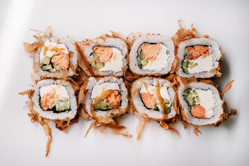 Sushi roll set with salmon, tuna and cream cheese close-up. Traditional Japanese cuisine....