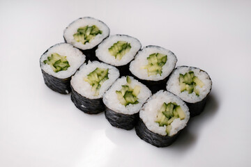 Sushi set with salmon, tuna and cream cheese close-up. Traditional Japanese cuisine on white background.