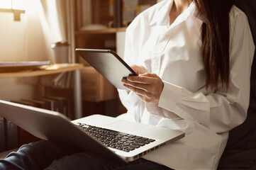 Businesswoman using mobile phone.Closeup at office