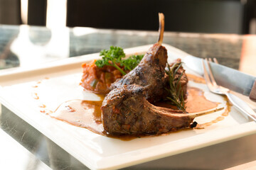 Grilled Race of New Zealand lamb with Rosemary Sauce International food at restaurant of hotel.