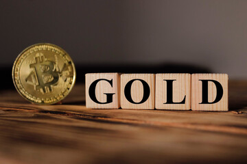 Wooden cubes with the inscription: "GOLD". bitcoin sale
