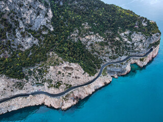 Aerial view of Aurelia street in Noli, Capo Noli and Varigotti, province of Savona. Drone photography from above of snake street snake in Liguria, north Italy, near Bergeggi and Spotorno.