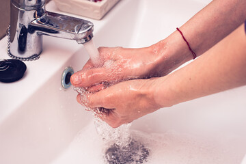 Hygiene to stop spreading coronavirus  (Washing hands rubbing with soap).