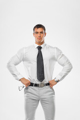 athlete bodybuilder in a white shirt looks through glasses on a purple background. Bsuiness and fitness concept.