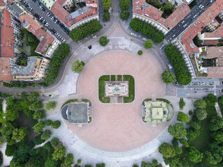 Aerial view of Arco della Pace in Milano, north Italy. Drone photography of Arch of Peace in Piazza Sempione, near Sempione park in the heart of Milan, Lombardy and Sforza Castle.