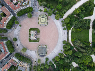 Aerial view of Arco della Pace in Milano, north Italy. Drone photography of Arch of Peace in Piazza Sempione, near Sempione park in the heart of Milan, Lombardy and Sforza Castle.