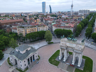 Aerial view of Arco della Pace in Milano, north Italy. Drone photography of Arch of Peace in Piazza Sempione, near Sempione park in the heart of Milan, Lombardy and Sforza Castle.