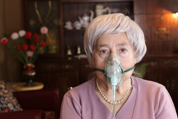 Lady using a green rubber breathing mask