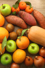 Various healthy fruit and vegetable on wooden background. Top view.