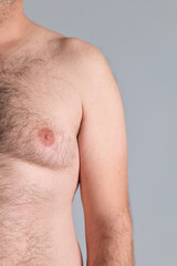 Half torso cropped of a caucasian fat man, with copy space, nude image