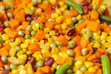 Cooking vegetables of corn, peas, peppers, beans close-up. Selective focus