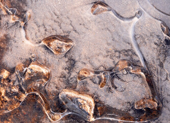 Stones frozen in puddle, Cheshire, UK