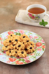 Kue Semprit, Indonesian Traditiona Cookies Served to Celebrate Lebaran Idul Fitri Ied Mubarak. Made from Butter, Flour, Egg, with Flower Shape