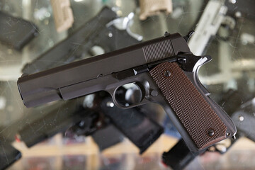 Pneumatic weapon on the glass table in army store