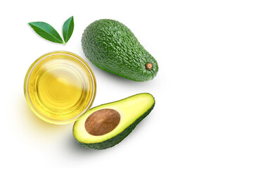 Avocado oil in glass bowl and fresh avocado fruit with green leaf isolated on white background. Top view. Flat lay.