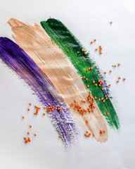 Mardi Gras New Orleans Green Gold and Purple Paint and beads on simple white background for style...