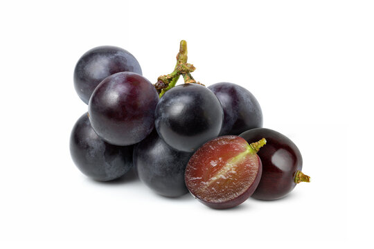 Black grape with half sliced isolated on white background. 