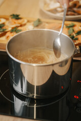 Mom cooks dinner, cooks spaghetti