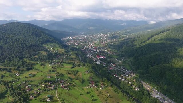 Fascinating aerial video of a small town in the mountains in summer