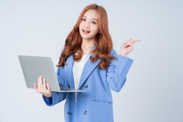 Young Asian businesswoman using laptop on white background