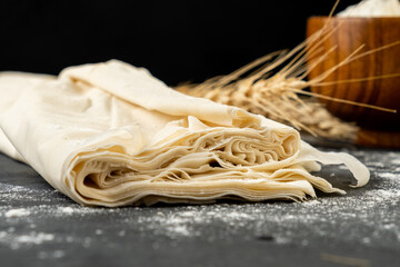 Thin layers of raw filo dough.
